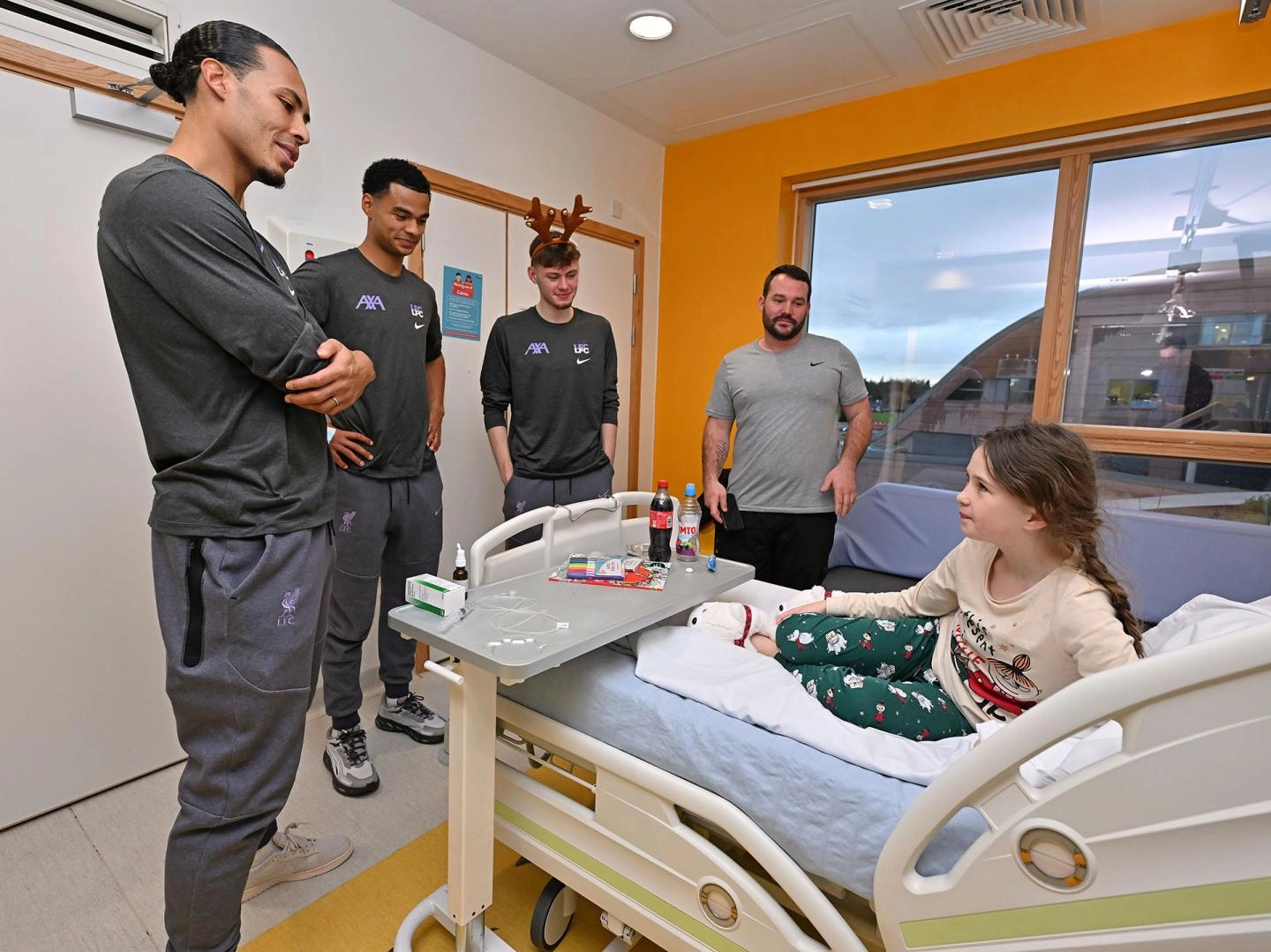 Photos and video: Liverpool men's squad make annual Christmas visit to  Alder Hey - Liverpool FC