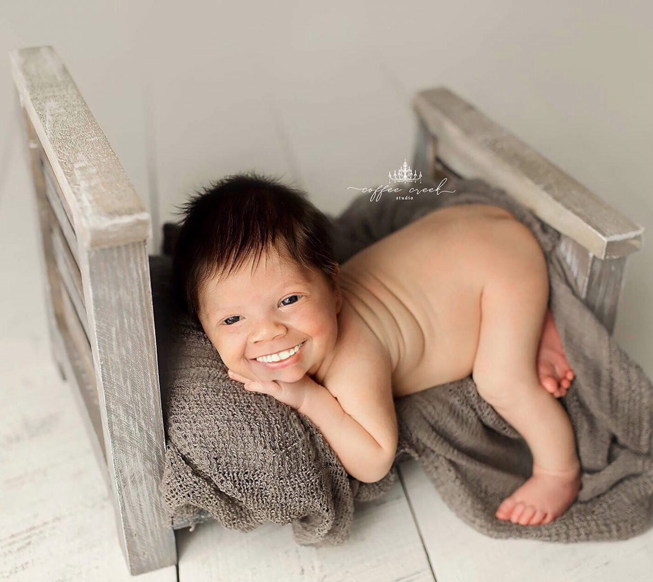 These photo is adds full sets of teeth to newborn photos and the results are both funny and creepy